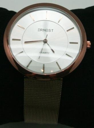 4,4 cm. stort hvidt ur, med kobber farvet stlrem.