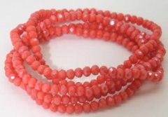 NY BILLIGERER FAST PRIS!! Coral farvet halskæde/armbånd. Små fine perler på elastik snor, der kan bruges til halskæde eller snores 5-6 gange om hånden og bruges til smart armbånd.